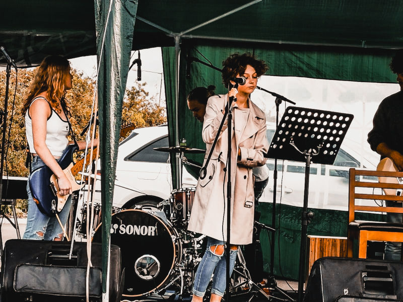 A girl student singing at a music event